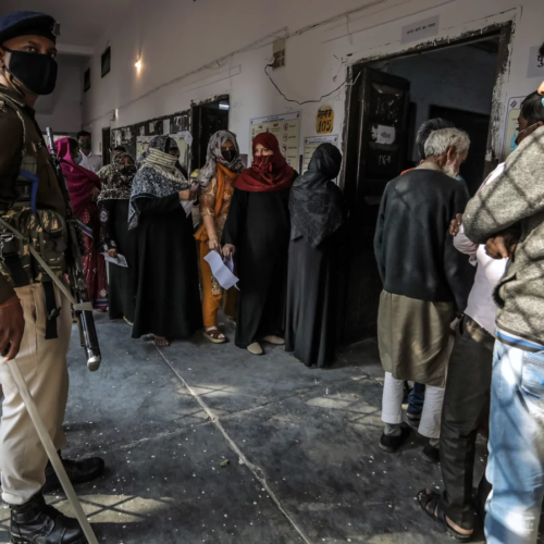 People queue to vote at a polling station in February in Lucknow. India's most populous state, Uttar Pradesh, is holding state elections as the ruling Hindu nationalist Bharatiya Janata Party of Narendra Modi looks to defend its majority