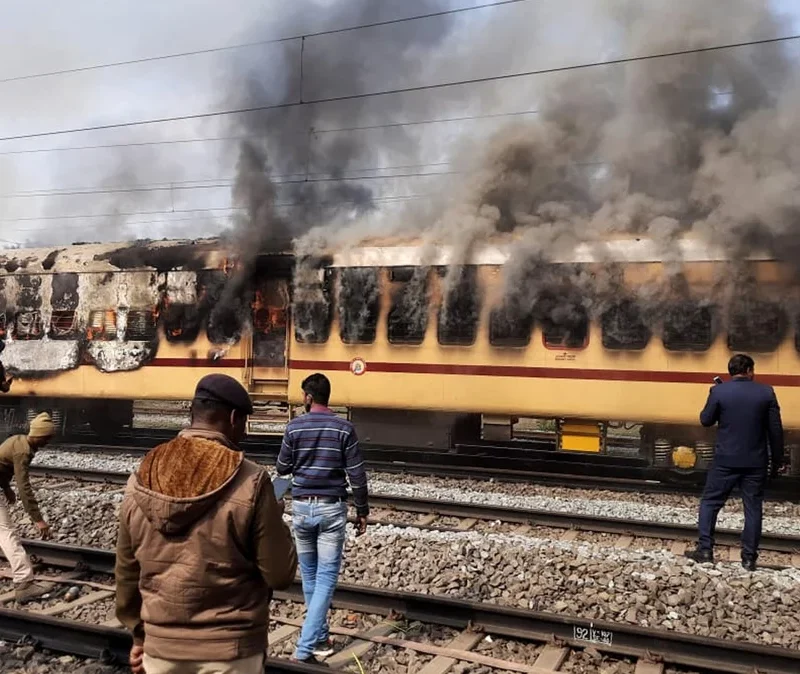 A mob set this train car afire as they protested railway jobs that set increasingly demanding requirements, shutting out many applicants. What the media called a "job riot" took place in Gaya in the northeast Indian state of Bihar on Jan. 26.